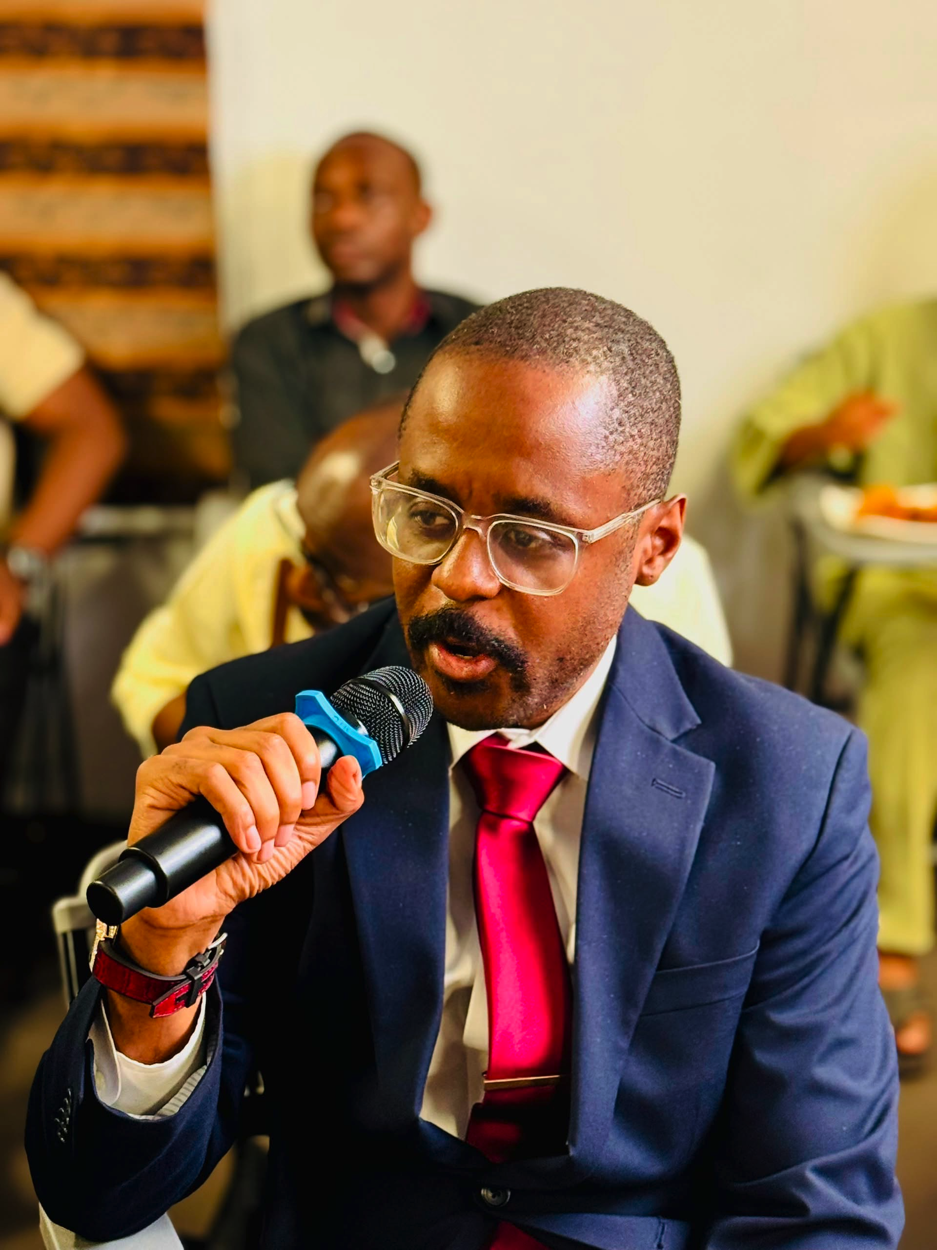 Chris Emejuru speaking at a community event